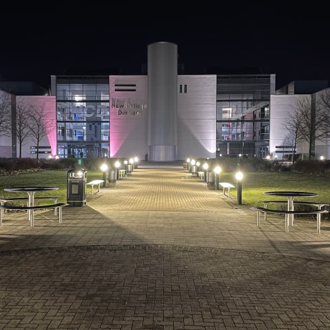 New College Durham at night